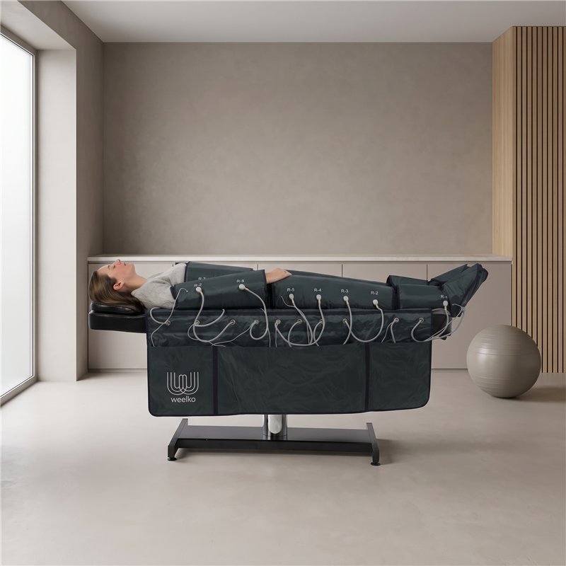 Combinaison Weelko WKB002 installée sur une table de soins pendant une séance corporelle